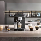DeLonghi Magnifica Evo Next Bean to Cup Coffee Machine on the kitchen counter with coffee cups